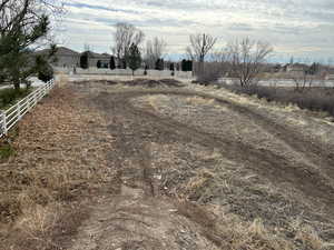 View of yard with a rural view