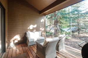 Wooden terrace featuring an outdoor living space