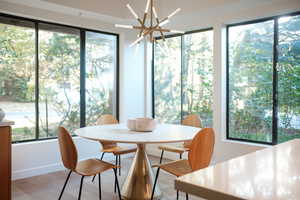 Sunroom / solarium with a chandelier