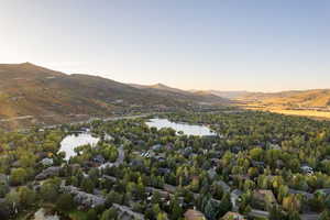 Aerial view at dusk with a water and mountain view