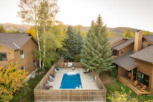 View of swimming pool with a mountain view