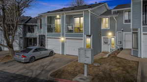 Townhome / multi-family property featuring a garage