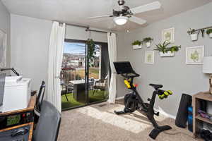 2nd bedroom with carpet and ceiling fan