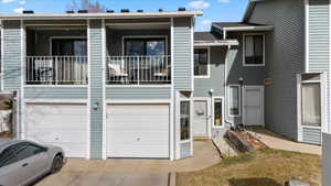 View of front facade featuring a garage