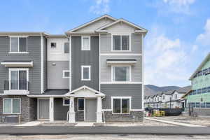 View of front of property featuring cooling unit and a mountain view