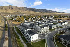 Birds eye view of property with a mountain view