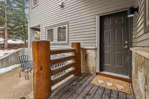 View of snow covered property entrance