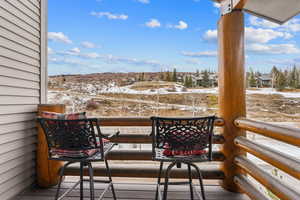 View of snow covered back of property