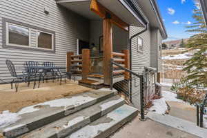 View of snow covered property entrance