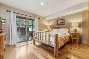 Bedroom featuring light wood-type flooring and access to outside