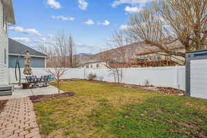 View of yard with a mountain view and a patio area