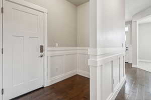 Corridor featuring dark hardwood / wood-style floors