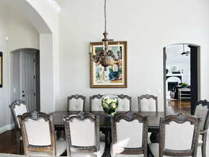 Dining space featuring ceiling fan and dark hardwood / wood-style flooring