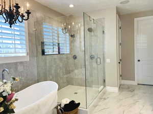 Bathroom featuring separate shower and tub