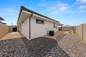 Back of property featuring central AC and a patio area