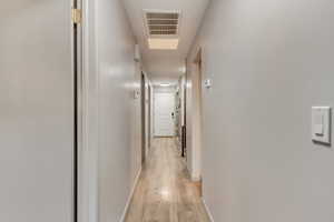 Corridor featuring light hardwood / wood-style flooring