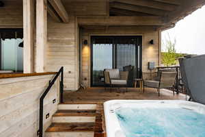 Exterior space featuring an outdoor hot tub