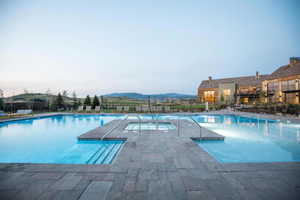 View of swimming pool featuring a mountain view and a patio area