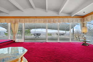 Interior space with lofted ceiling with beams