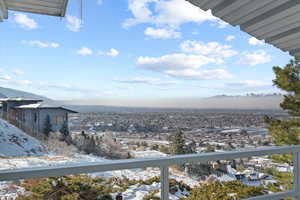 View of snow covered back of property