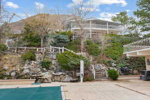 View of swimming pool featuring a mountain view and a patio