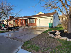 Single story home featuring a garage