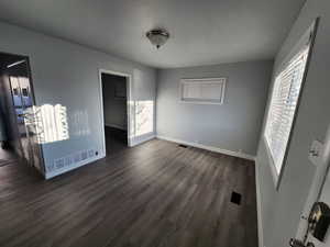 Interior space featuring dark hardwood / wood-style flooring