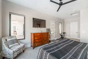 Bedroom featuring ceiling fan and light colored carpet