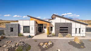 Back of house featuring a mountain view