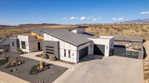 View of front facade featuring a mountain view and a garage