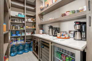 Pantry featuring wine cooler