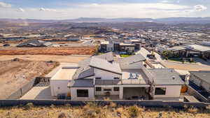 Birds eye view of property with a mountain view