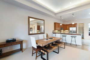 Dining space featuring a tray ceiling