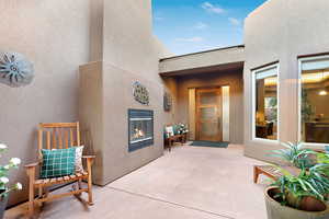 View of patio featuring a tiled fireplace