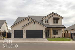 View of front of house with a garage and a porch