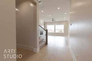 Hallway featuring light wood-type flooring