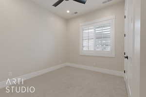 Carpeted bedroom with ceiling fan