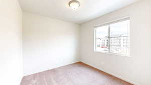 Empty room with carpet flooring