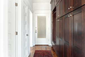 Hallway featuring dark hardwood / wood-style floors