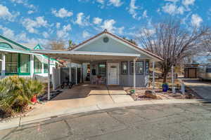 View of front of home with a carport