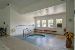 View of pool featuring an indoor hot tub