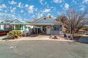 View of front of home with a carport