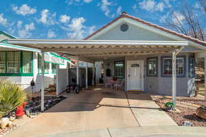 View of front of property with a carport