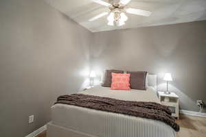 Bedroom featuring ceiling fan and light hardwood / wood-style flooring