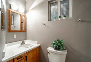 Bathroom featuring vanity and toilet