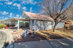 Exterior space featuring a carport