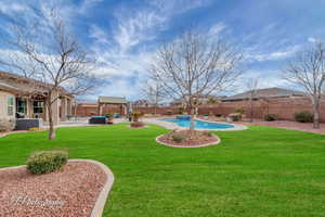 View of yard with an outdoor hangout area, central AC unit, a fenced in pool, a gazebo, and a patio area