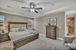 Carpeted bedroom with ceiling fan