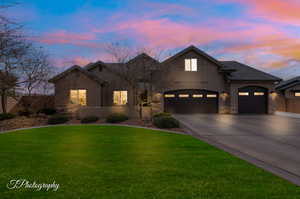 View of front of property featuring a lawn