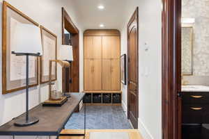 Corridor featuring sink